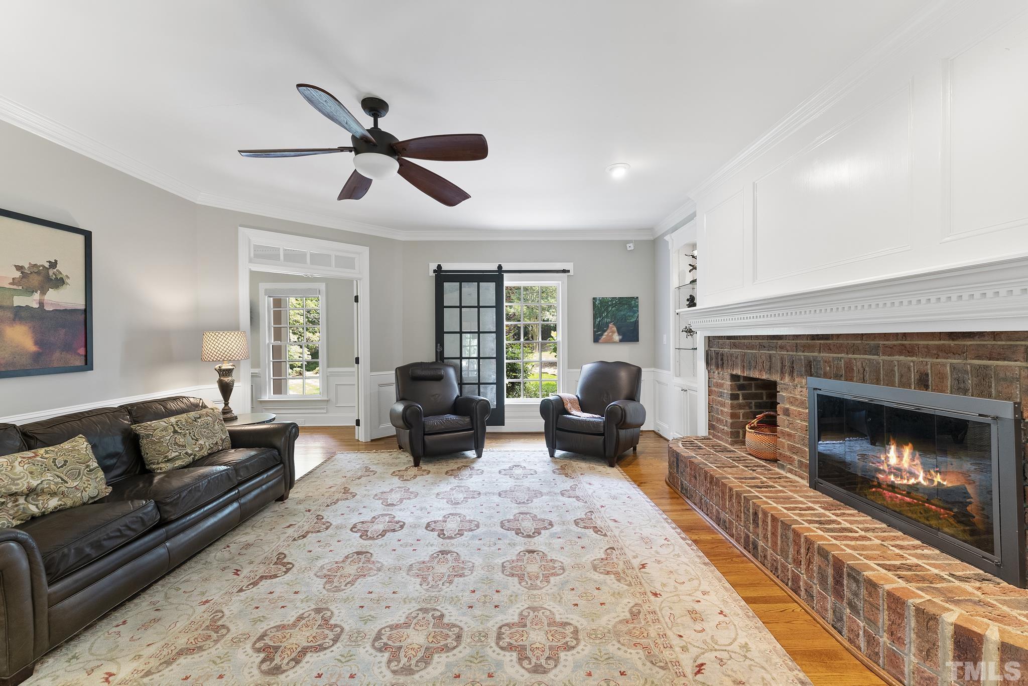 1113 Bentham Drive Raleigh, NC 27614 - Photo 20 of 78 a living room with furniture and a fireplace