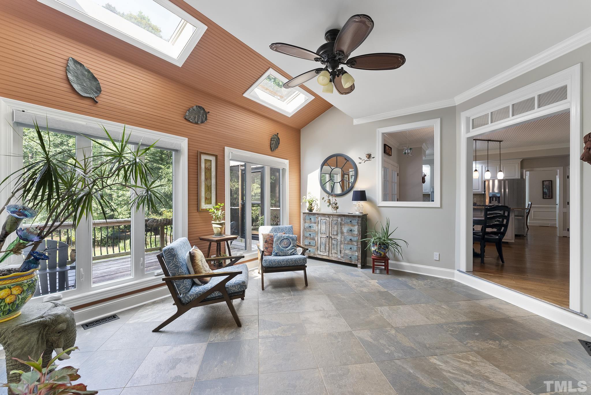 1113 Bentham Drive Raleigh, NC 27614 - Photo 24 of 78 a living room with furniture a fireplace and a large window