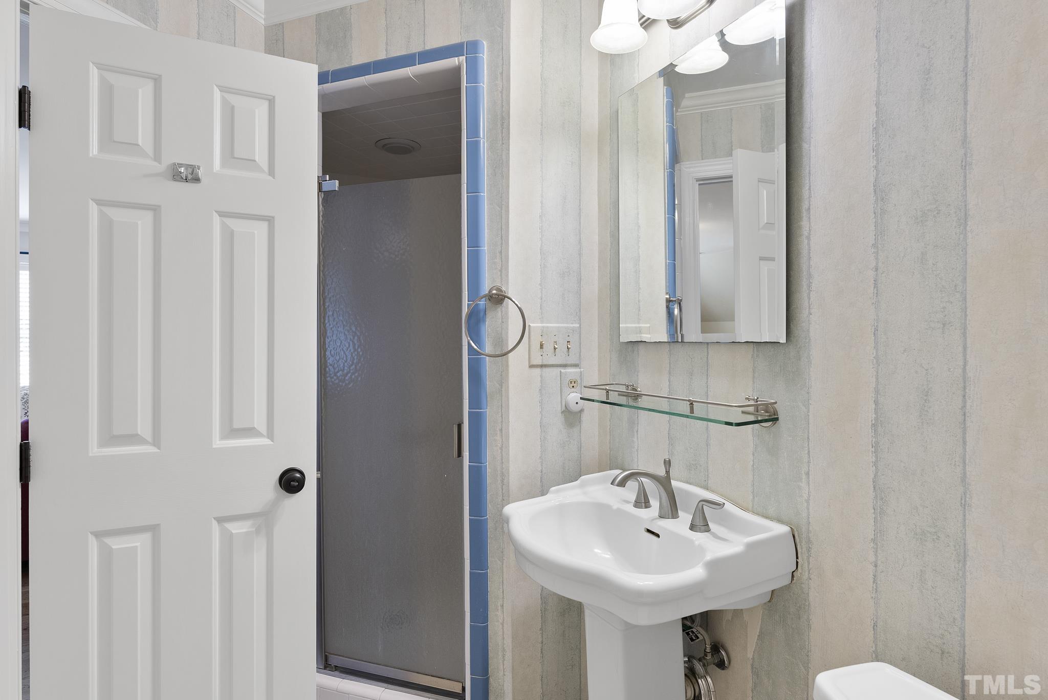 1113 Bentham Drive Raleigh, NC 27614 - Photo 36 of 78 a bathroom with a sink a mirror and shower