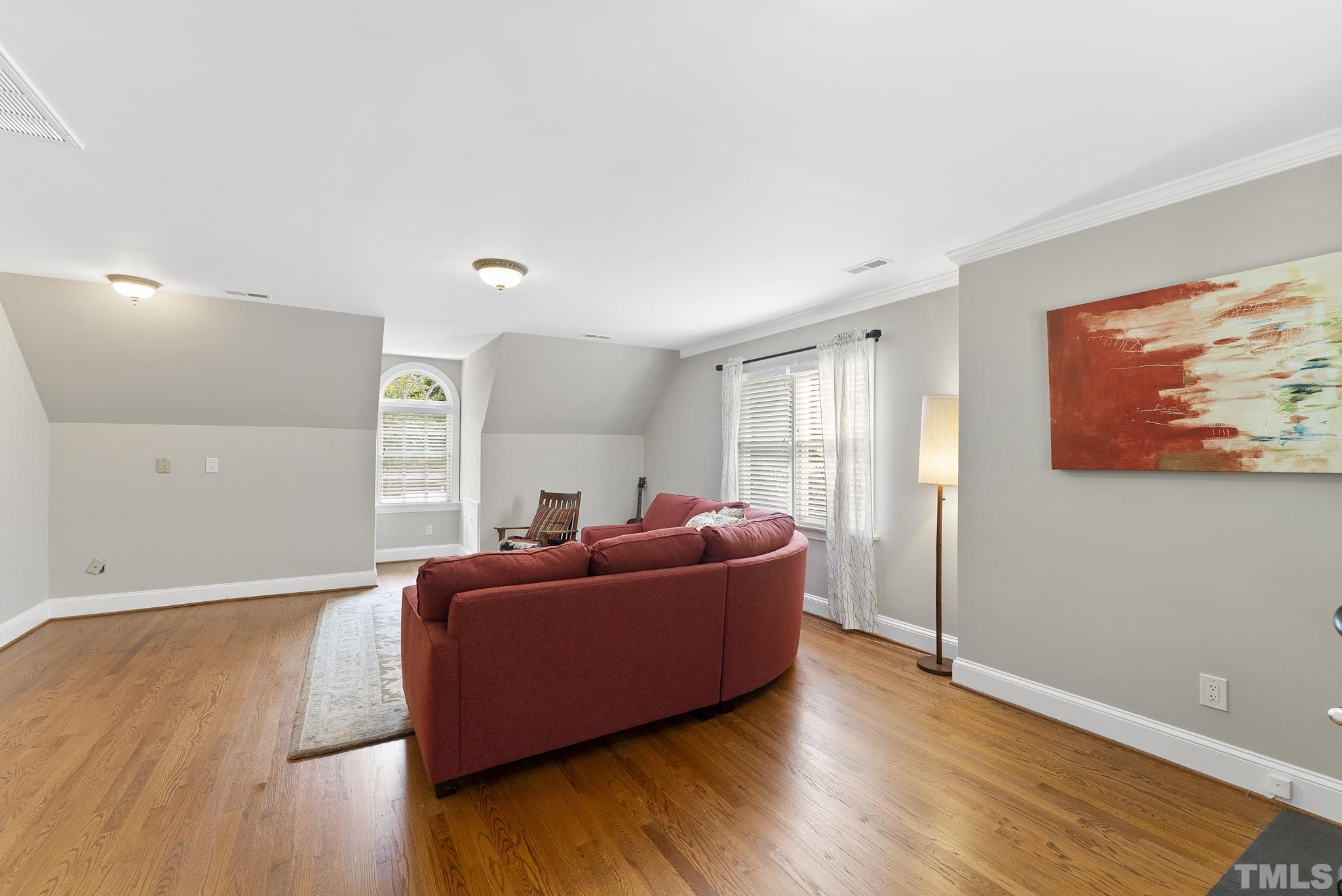 1113 Bentham Drive Raleigh, NC 27614 - Photo 38 of 78 a living room with furniture and a wooden floor