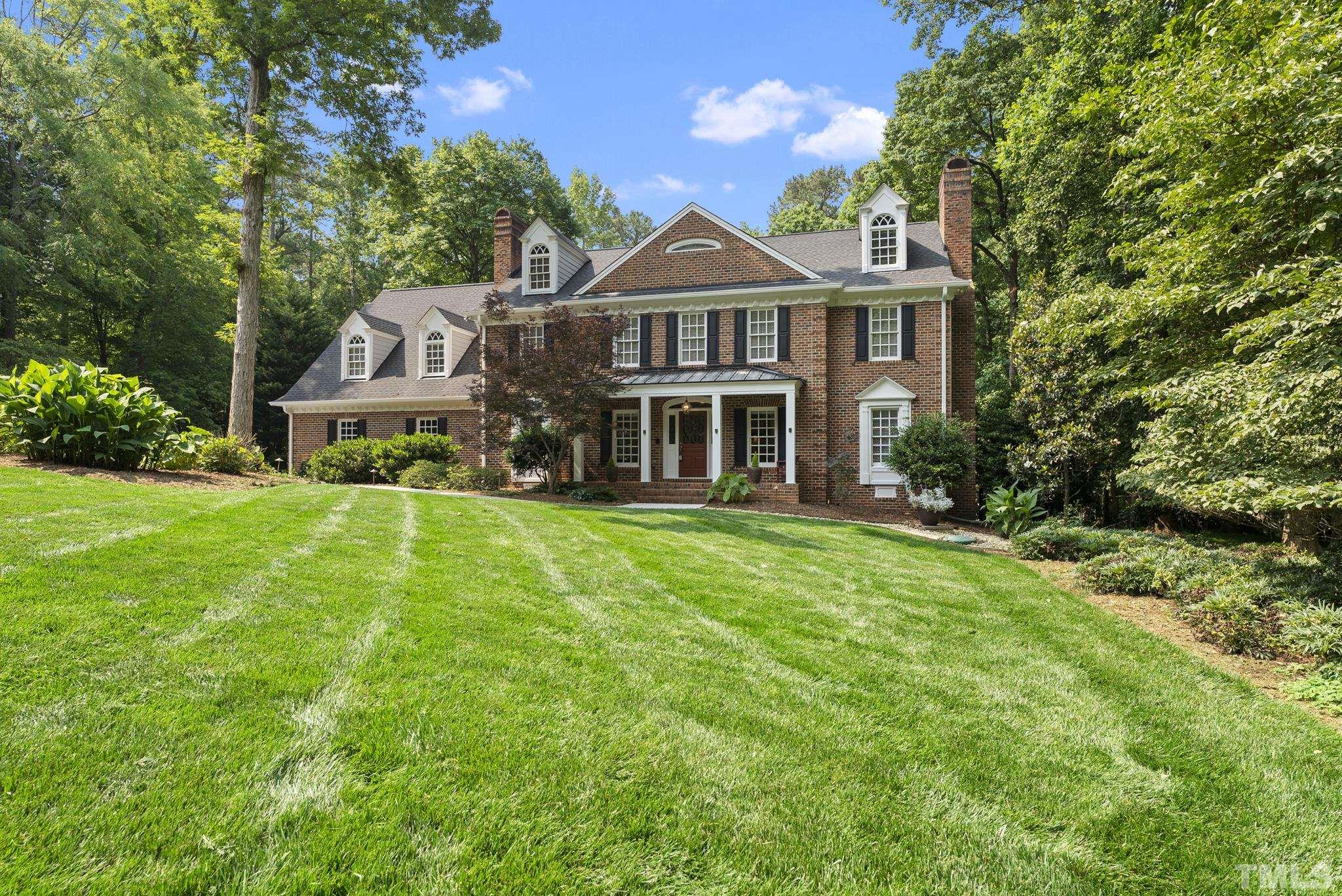 1113 Bentham Drive Raleigh, NC 27614 - Photo 4 of 78 a front view of a house with a yard and trees
