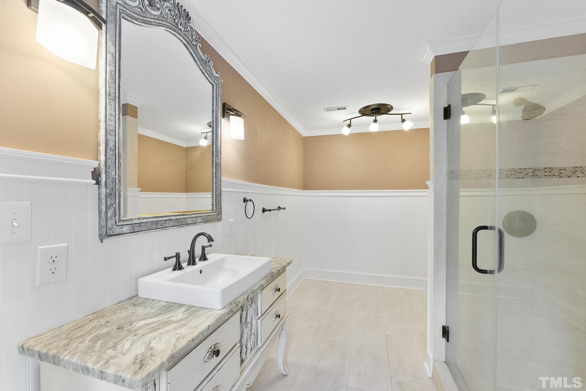 1113 Bentham Drive Raleigh, NC 27614 - Photo 42 of 78 a bathroom with a sink vanity and a mirror