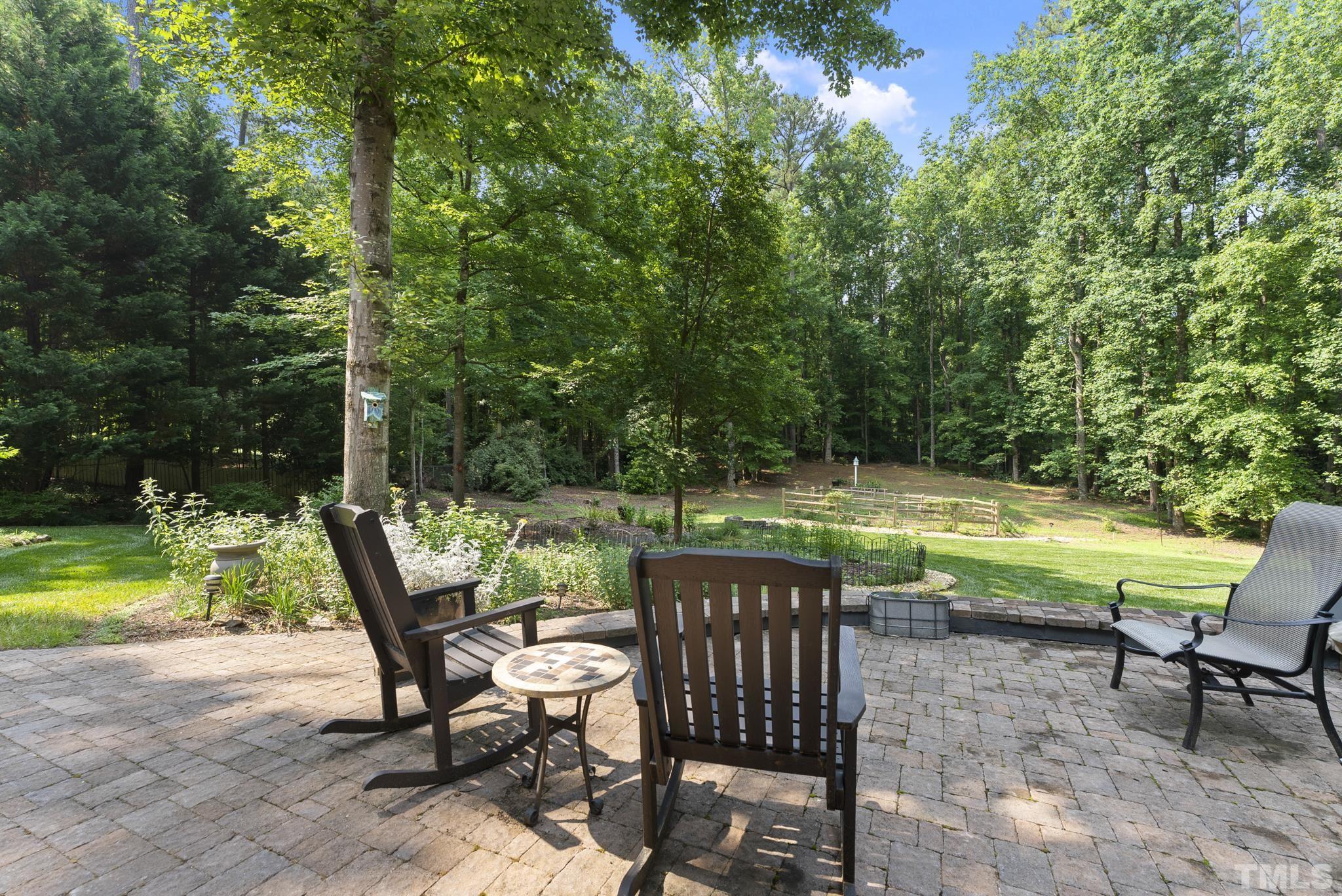 1113 Bentham Drive Raleigh, NC 27614 - Photo 43 of 78 a view of a swimming pool with lawn chairs and a big yard