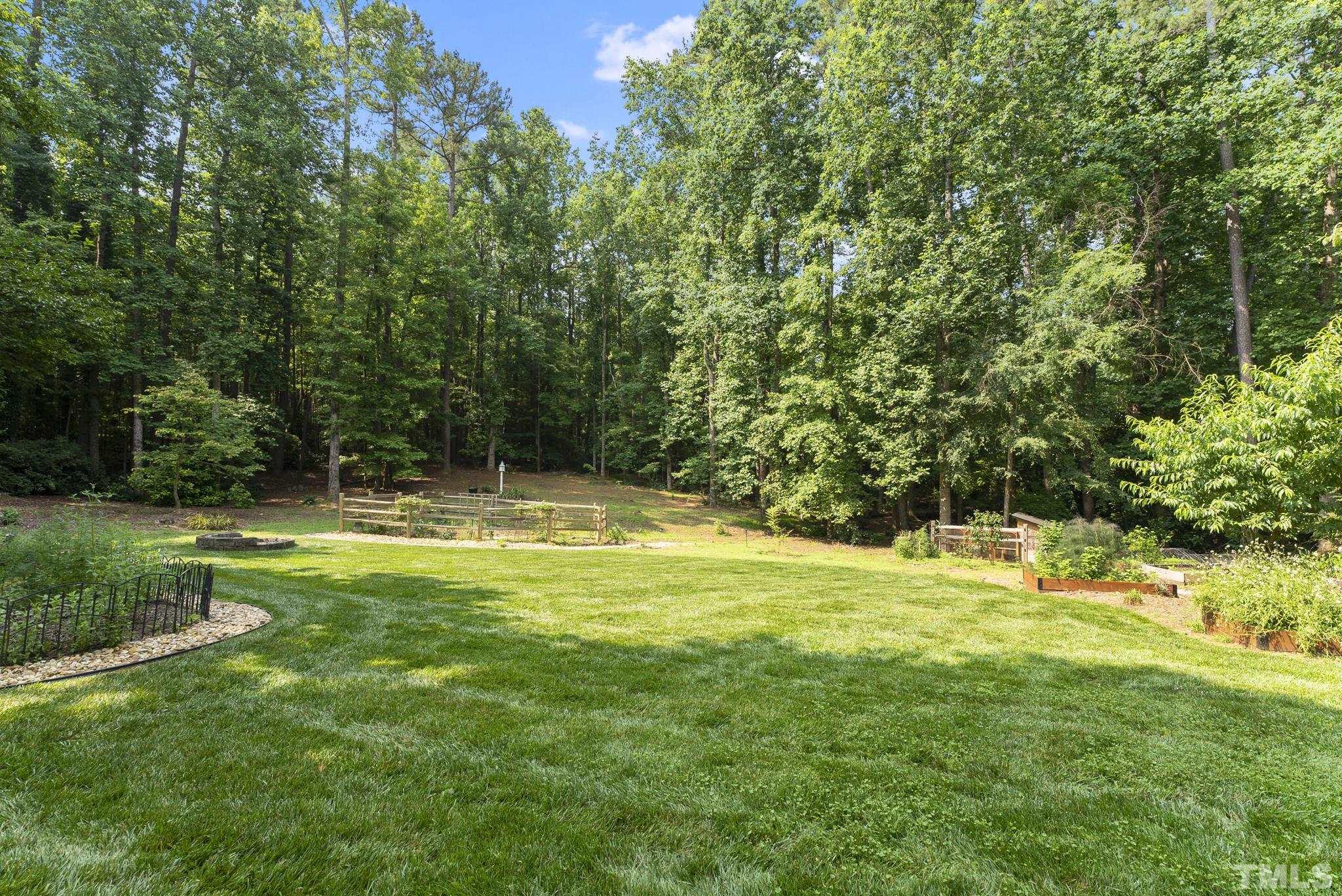 1113 Bentham Drive Raleigh, NC 27614 - Photo 45 of 78 a view of a swimming pool with a big yard and large trees
