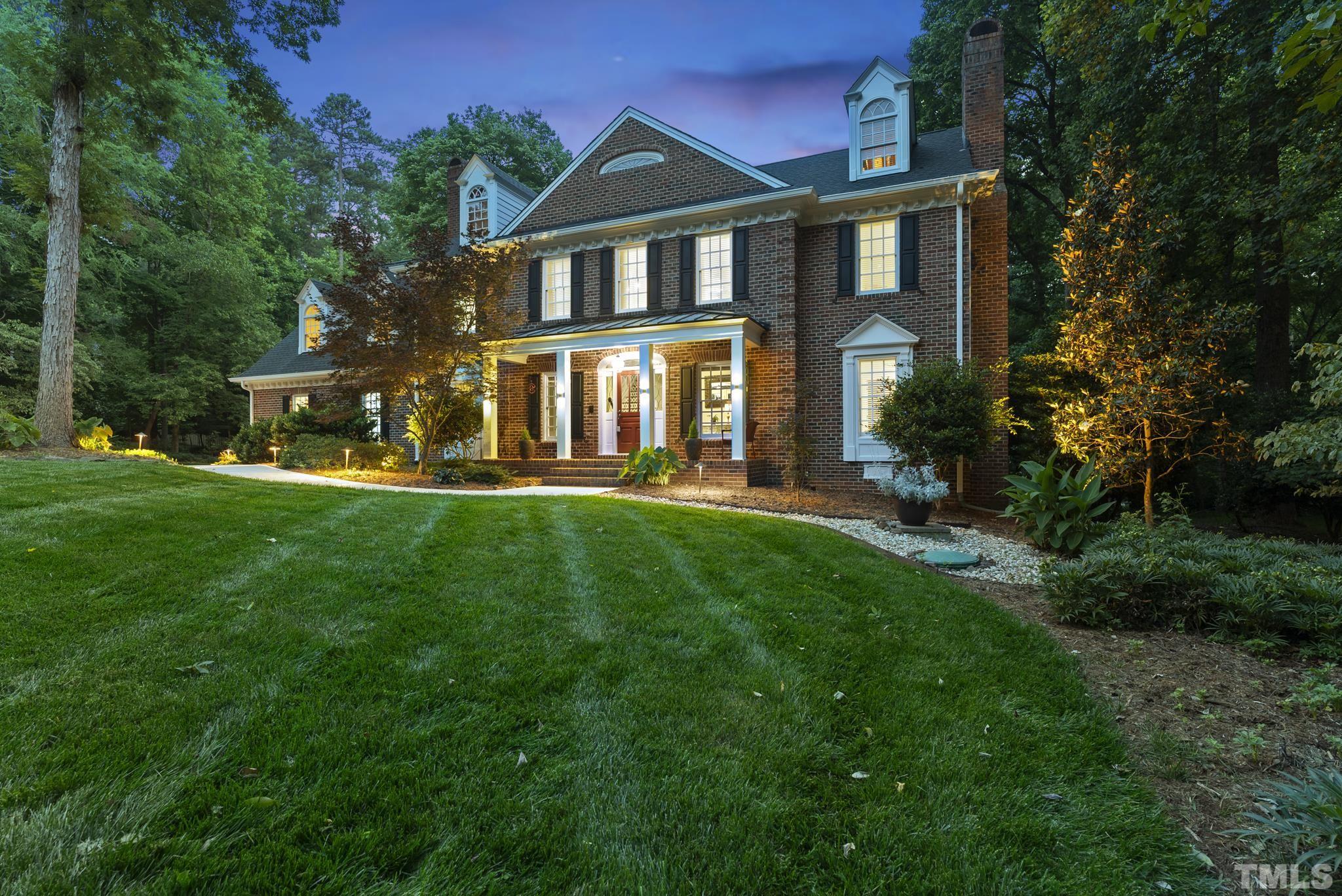 1113 Bentham Drive Raleigh, NC 27614 - Photo 76 of 78 a front view of a house with a yard and trees