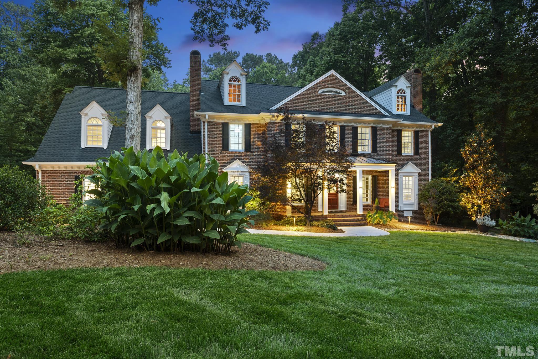 1113 Bentham Drive Raleigh, NC 27614 - Photo 77 of 78 a front view of a house with a garden