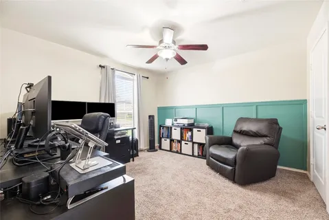 a living room with furniture and a dining table with kitchen view