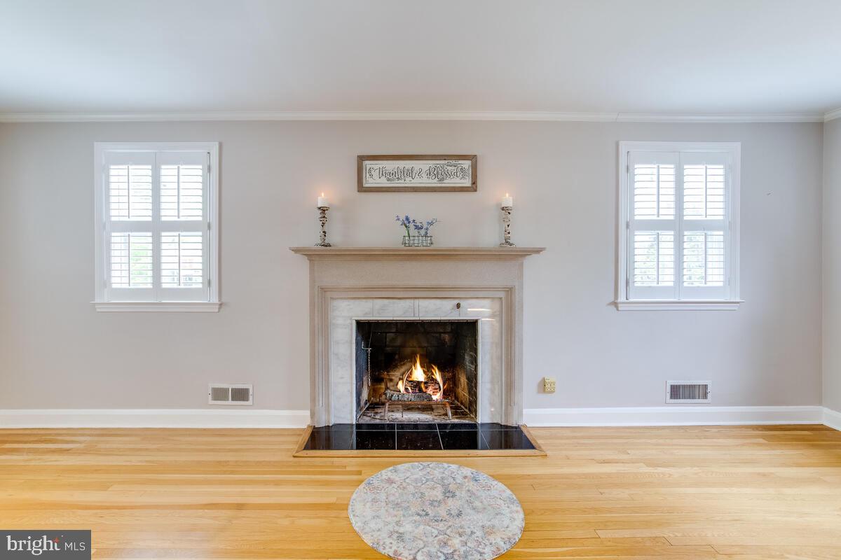 33 Dunmore Road Baltimore, MD 21228 - Photo 12 of 78 a living room with furniture and a fireplace