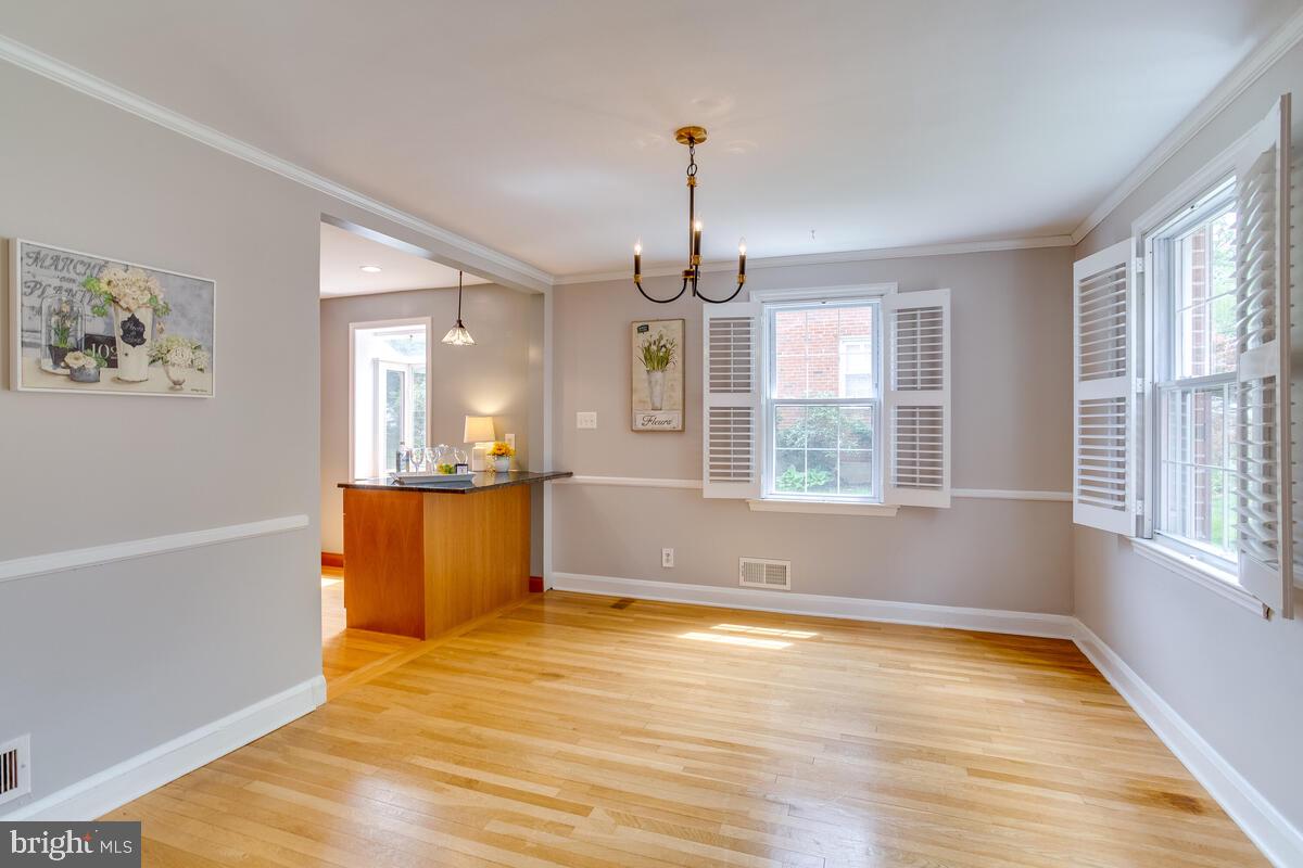 33 Dunmore Road Baltimore, MD 21228 - Photo 13 of 78 a view of an empty room with window and wooden floor