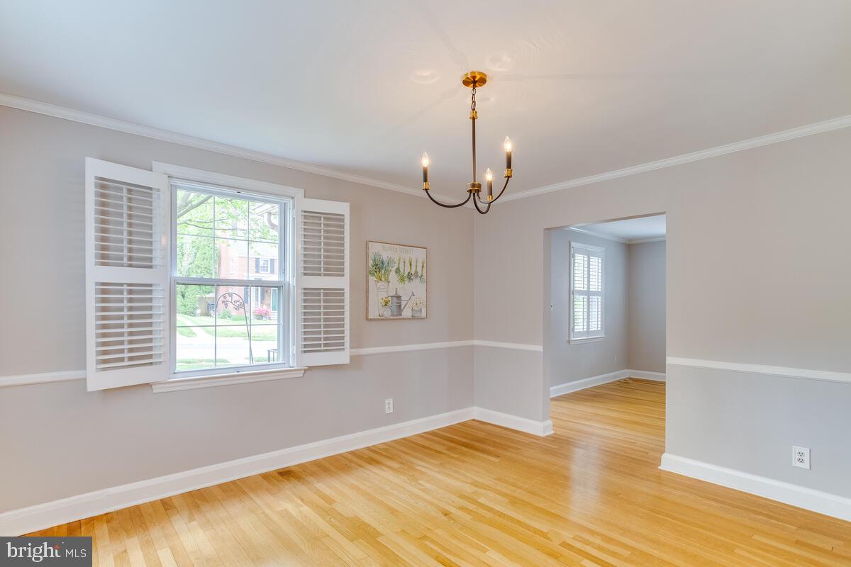 33 Dunmore Road Baltimore, MD 21228 - Photo 15 of 78 a view of empty room with wooden floor and fan