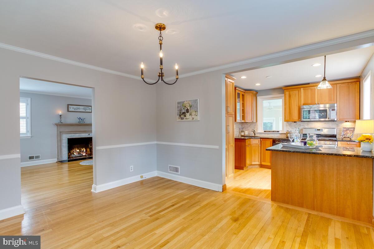 33 Dunmore Road Baltimore, MD 21228 - Photo 16 of 78 a view of a kitchen with furniture and floor to ceiling window