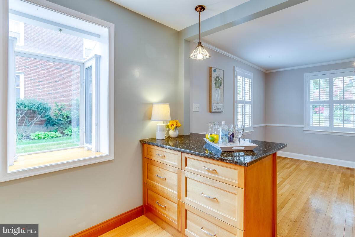 33 Dunmore Road Baltimore, MD 21228 - Photo 21 of 78 a kitchen with stainless steel appliances granite countertop a sink a stove and a window
