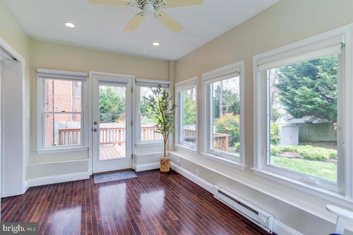 33 Dunmore Road Baltimore, MD 21228 - Photo 33 of 78 a view of an empty room with wooden floor and a window