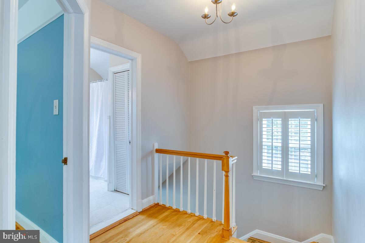 33 Dunmore Road Baltimore, MD 21228 - Photo 38 of 78 a view of a bedroom with wooden floor and a window
