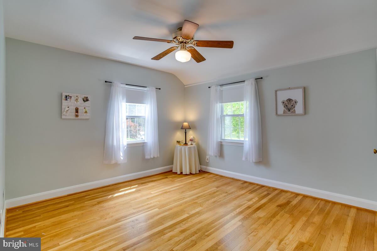 33 Dunmore Road Baltimore, MD 21228 - Photo 44 of 78 a view of empty room with wooden floor and fan