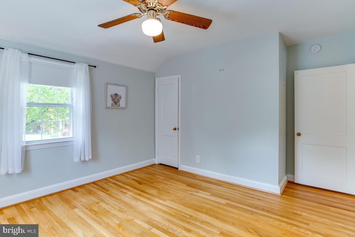 33 Dunmore Road Baltimore, MD 21228 - Photo 45 of 78 a view of empty room with wooden floor and fan