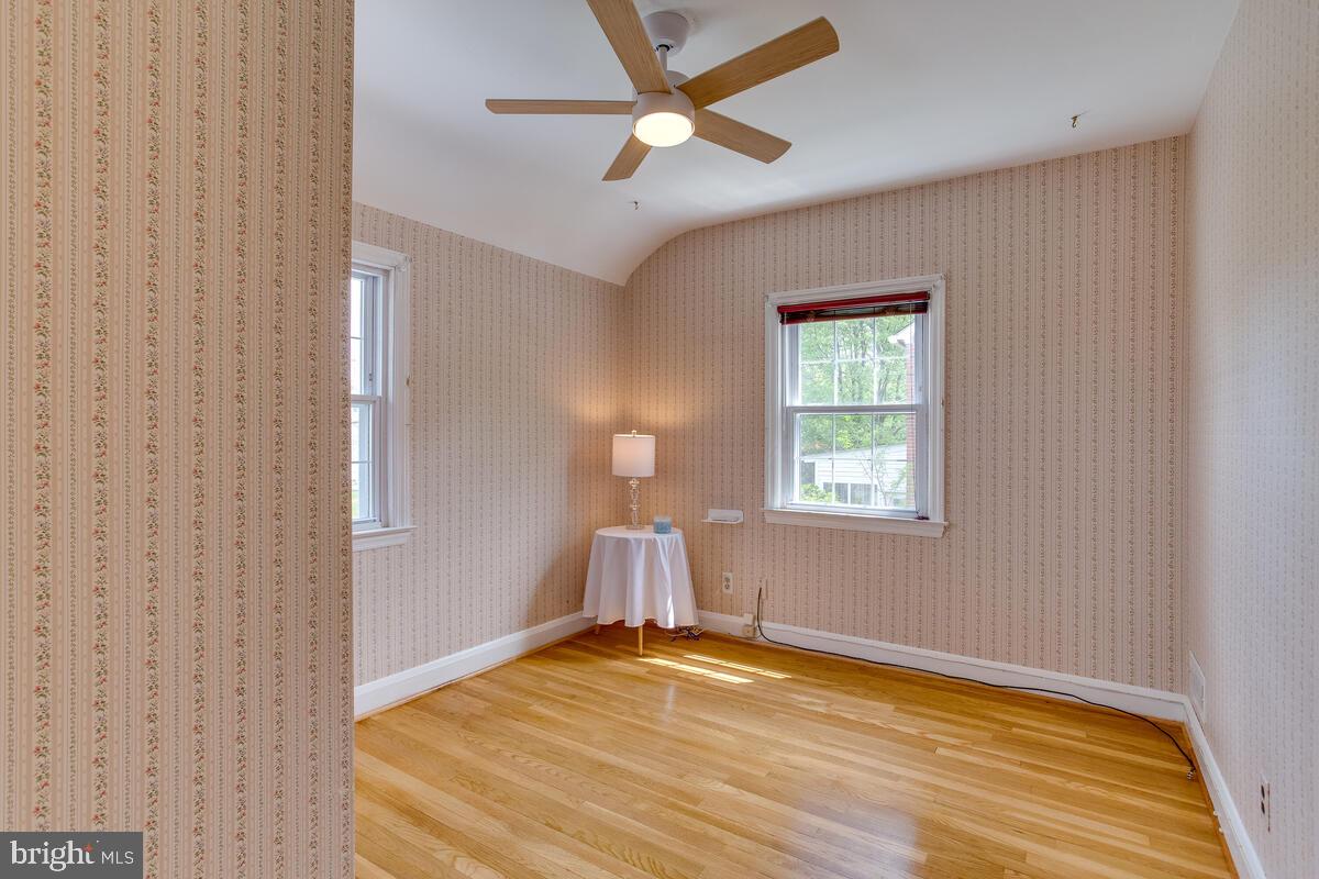 33 Dunmore Road Baltimore, MD 21228 - Photo 47 of 78 a view of empty room with wooden floor and fan