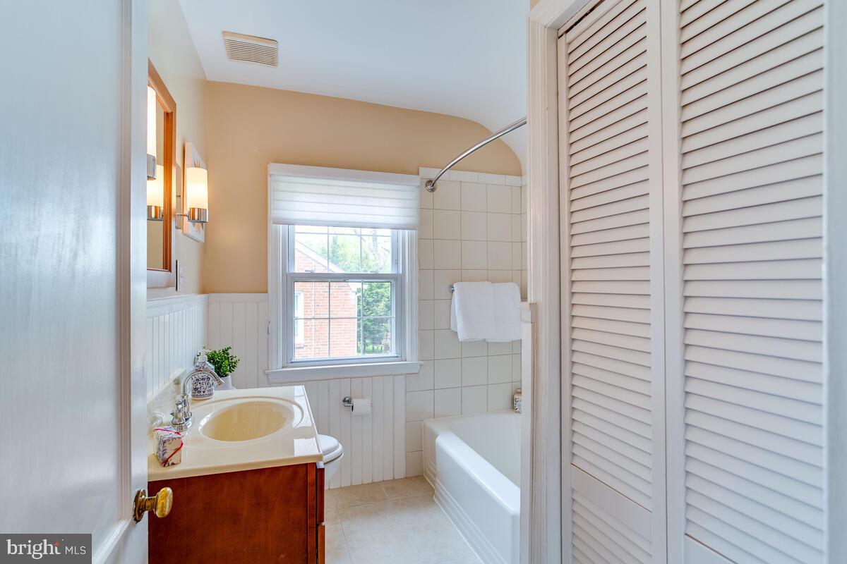 33 Dunmore Road Baltimore, MD 21228 - Photo 50 of 78 a bathroom with a sink a tub and a window