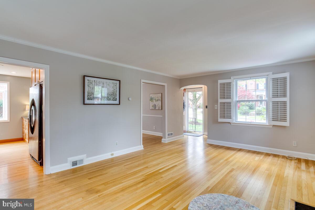 33 Dunmore Road Baltimore, MD 21228 - Photo 10 of 78 a view of empty room with wooden floor and fan
