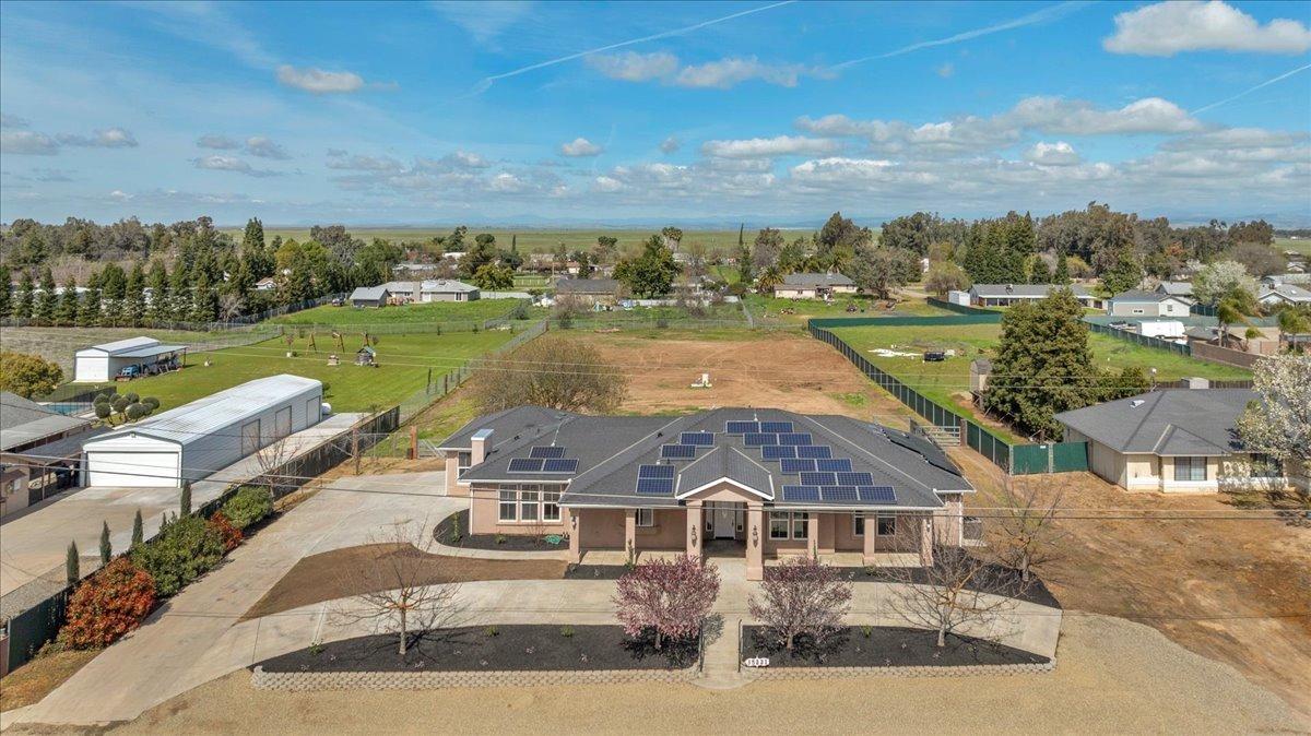 an aerial view of a house with a lake view