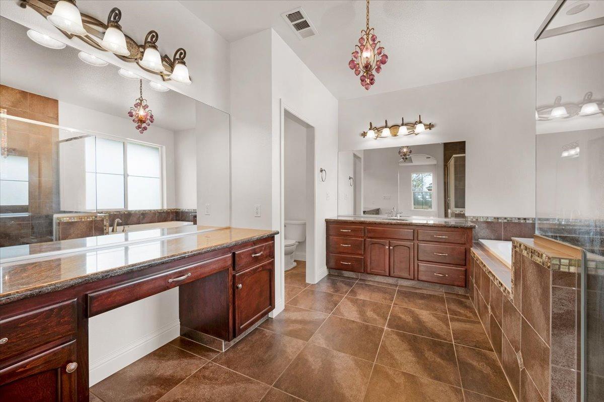 35221 John Albert Drive Madera, CA 93636 - Photo 15 of 22 a large kitchen with a sink and dishwasher
