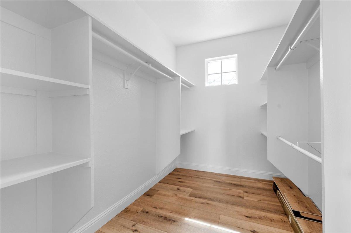 35221 John Albert Drive Madera, CA 93636 - Photo 17 of 22 a view of small space with wooden floor and staircase