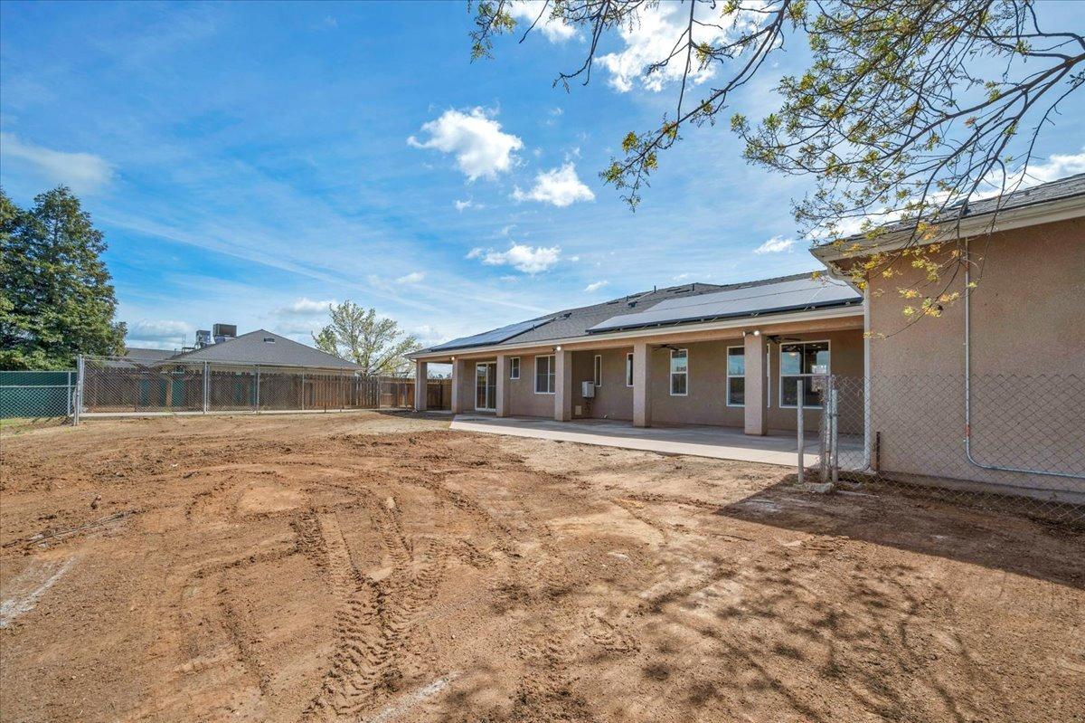35221 John Albert Drive Madera, CA 93636 - Photo 20 of 22 a front view of a house with a yard