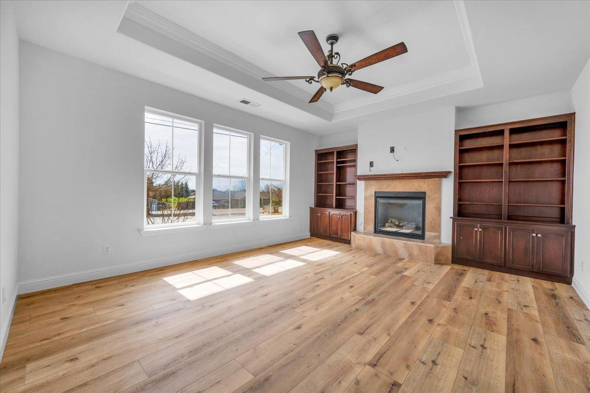 35221 John Albert Drive Madera, CA 93636 - Photo 3 of 22 a view of empty room with a fireplace and window