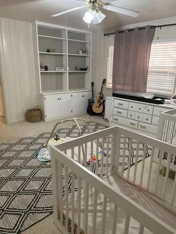 a kitchen with sink cabinets and window