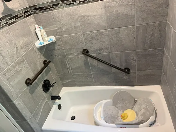 a bathroom with a tub and shower