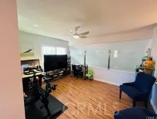 a bedroom with a bed and a potted plant