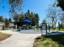 a view of a garden with swings