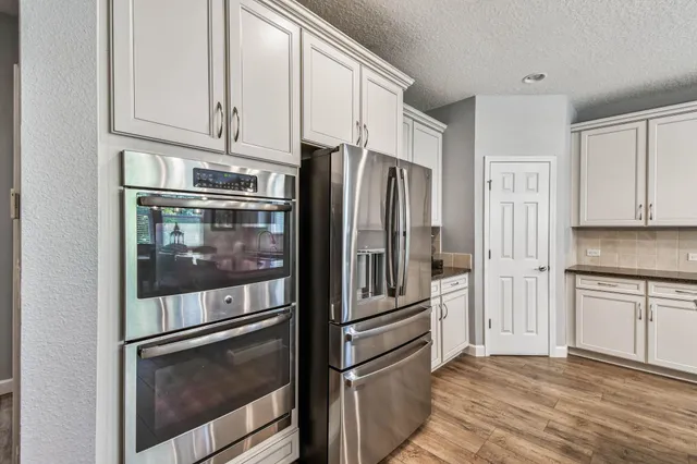 a bathroom with a sink mirror and toilet