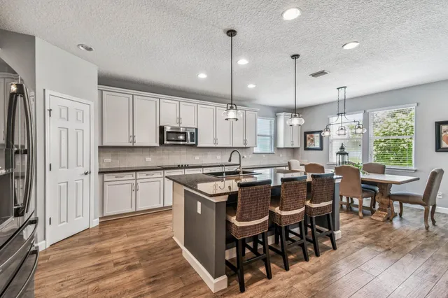 a bedroom with a large bed and a flat screen tv