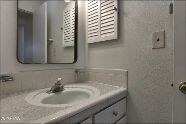 a bathroom with a shower and a toilet