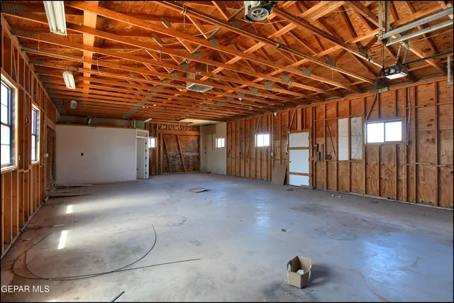 a view of an empty room with windows