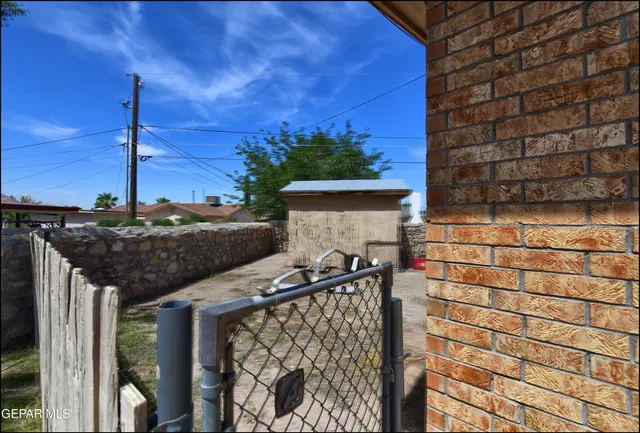 a view of backyard with seating space