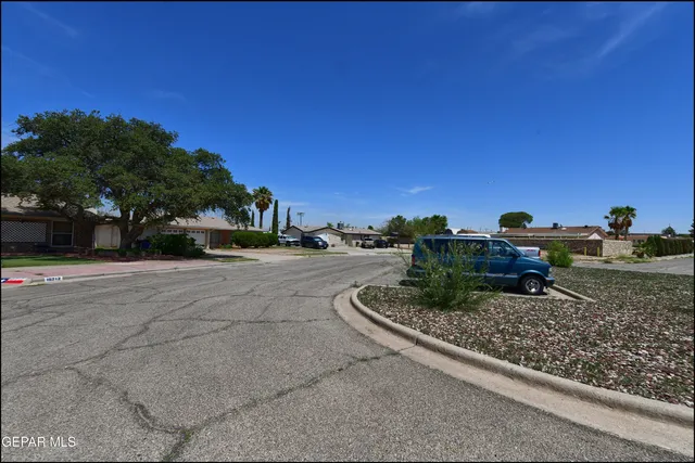 a view of a car parked on the side of the road
