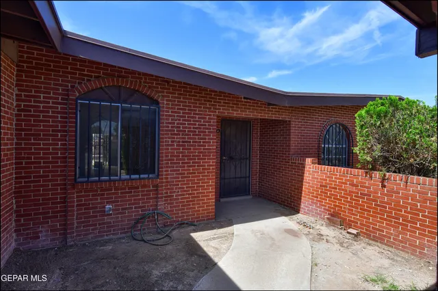a backyard of a house with seating space