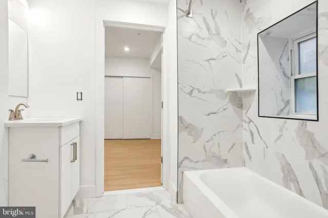 a bathroom with a bathtub and shower