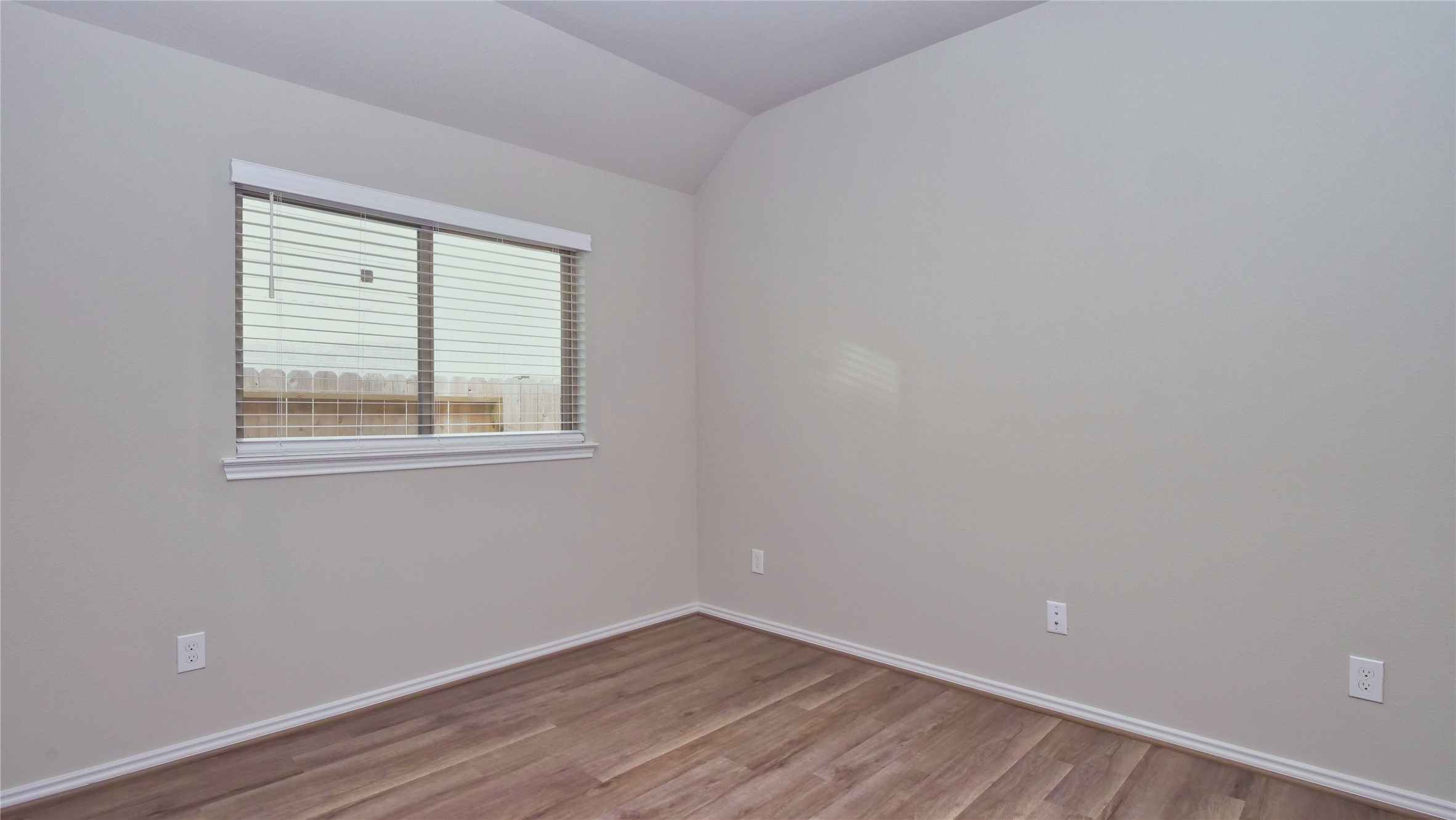 7343 Mount Greylock Loop Porter, TX 77365 - Photo 11 of 17 wooden floor in an empty room with a window