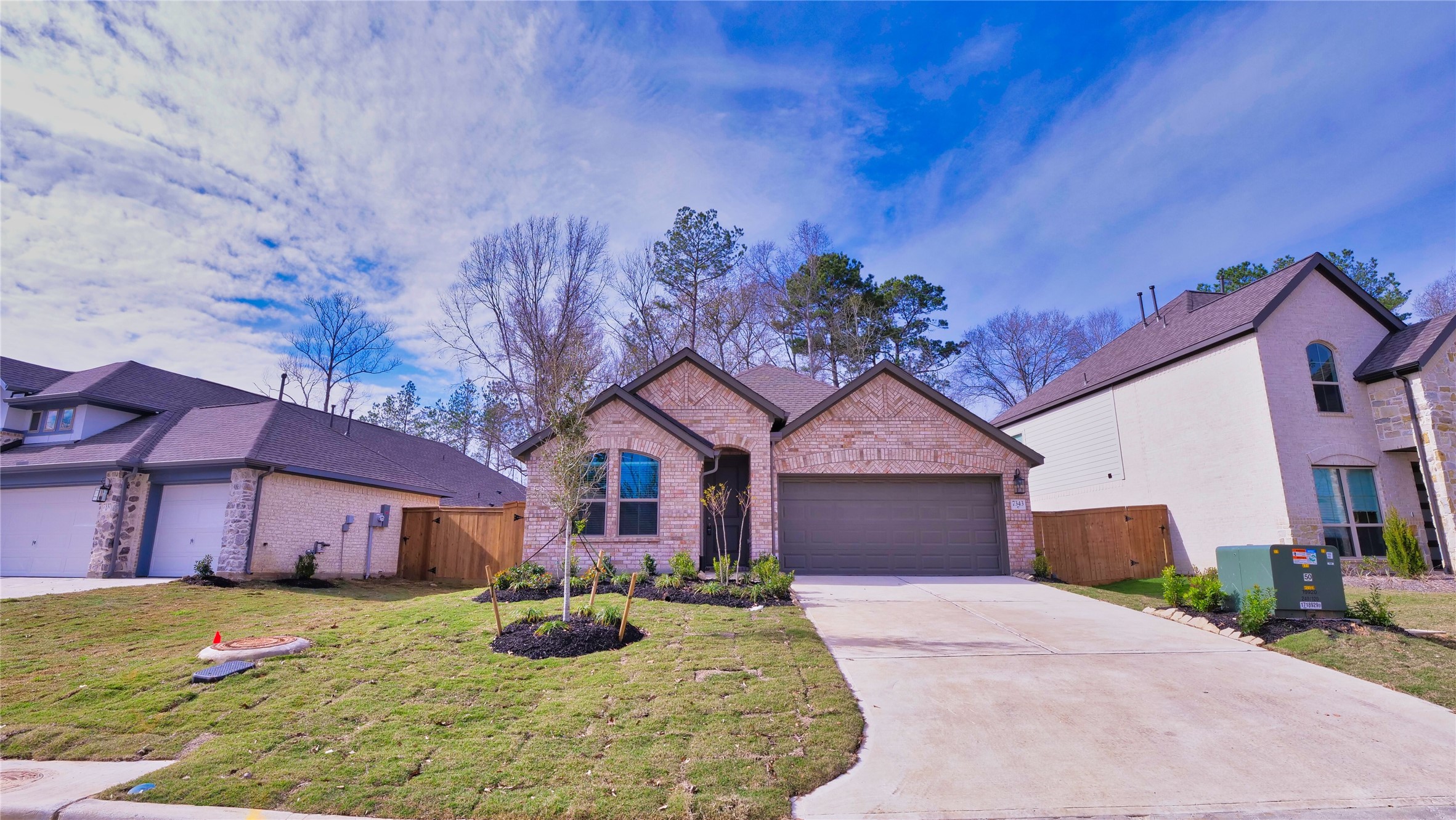 7343 Mount Greylock Loop Porter, TX 77365 - Photo 2 of 17 a front view of a house with garden