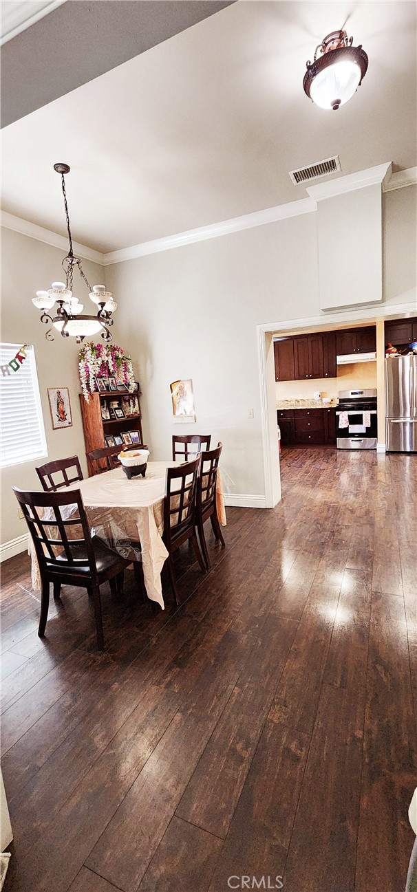 3112-3130 1st Street Riverside, CA 92507 - Photo 9 of 75 a living room with furniture and a chandelier