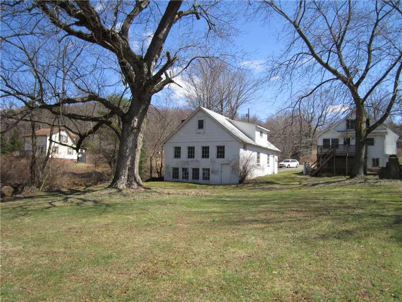 480 Kings Road Apollo, PA 15613 - Photo 21 of 23 Exterior Back. View from yard towards back of garage on left, home on right.