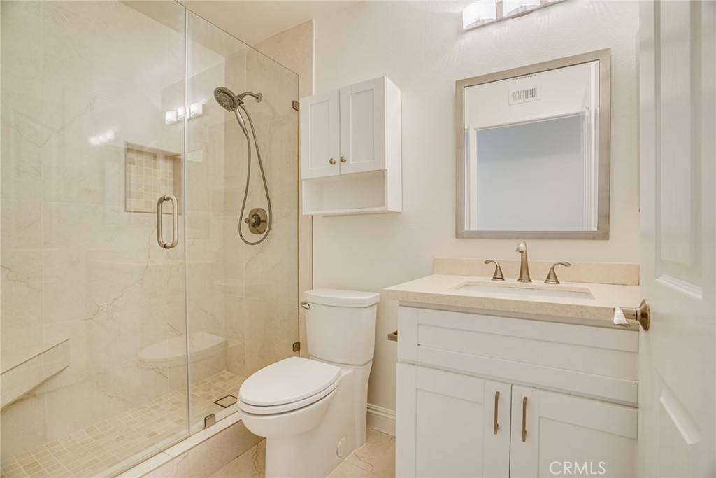 49 East Yale Loop, Unit 26 Irvine, CA 92604 - Photo 27 of 63 a bathroom with a sink toilet and shower