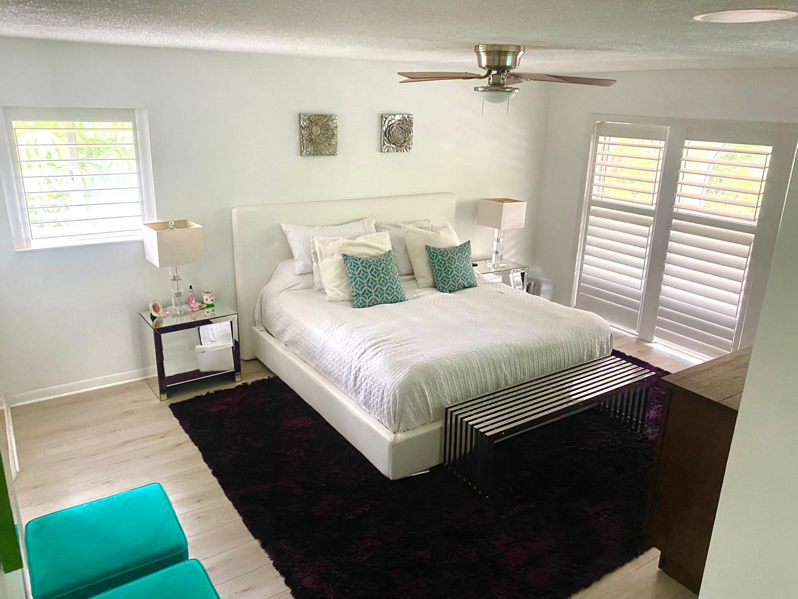 13770 Oneida Drive, Unit B2 Delray Beach, FL 33446 - Photo 7 of 14 a bedroom with a bed and a window