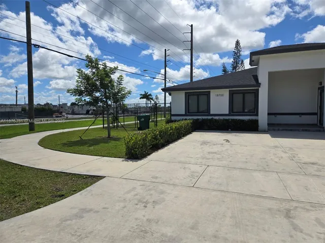a view of a house with a sink and a yard