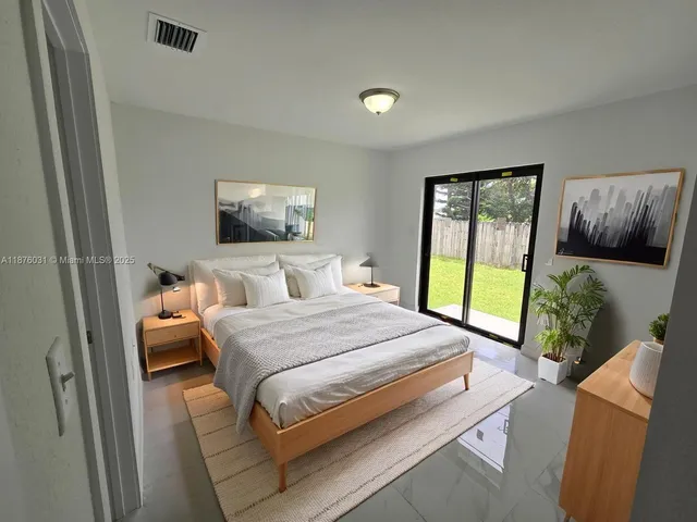 a bedroom with a bed and glass window