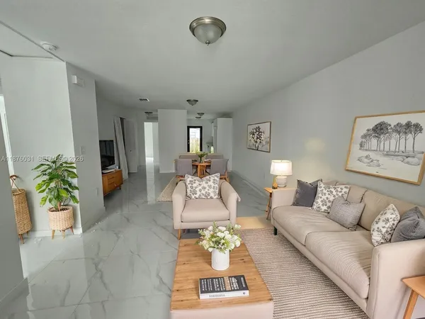 a living room with furniture and a rug