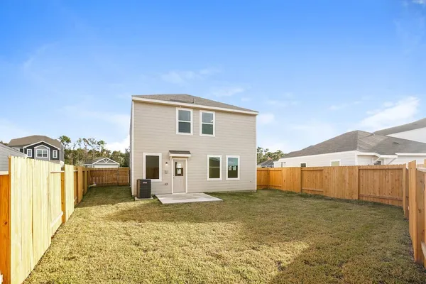 a view of a house with backyard